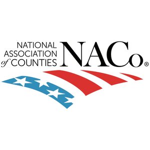 NACo logo features blue stars and red stripes, symbolizing a flag, with text 
