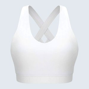White sports bra displays crisscross straps in a plain, light gray background.