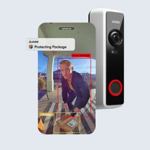 Doorbell camera detects person near package on porch, alerting 