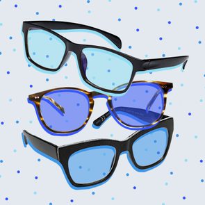 Three pairs of glasses are layered, floating against a blue polka-dotted background. Each has distinct frames and tinted lenses, adding visual contrast.