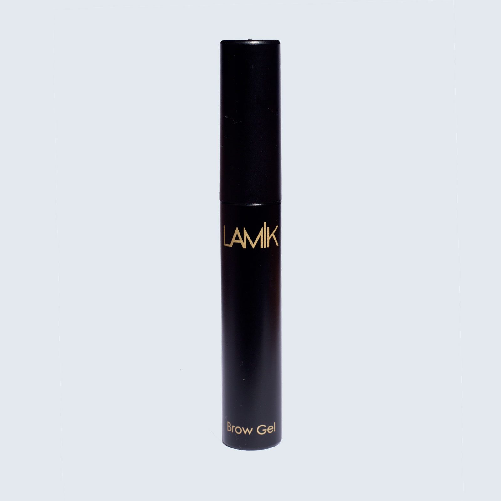 Black tube displays "LAMIK" and "Brow Gel" in gold text, standing upright against a light gray background.