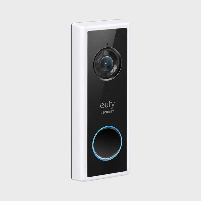 A rectangular video doorbell with a camera lens, brand label 
