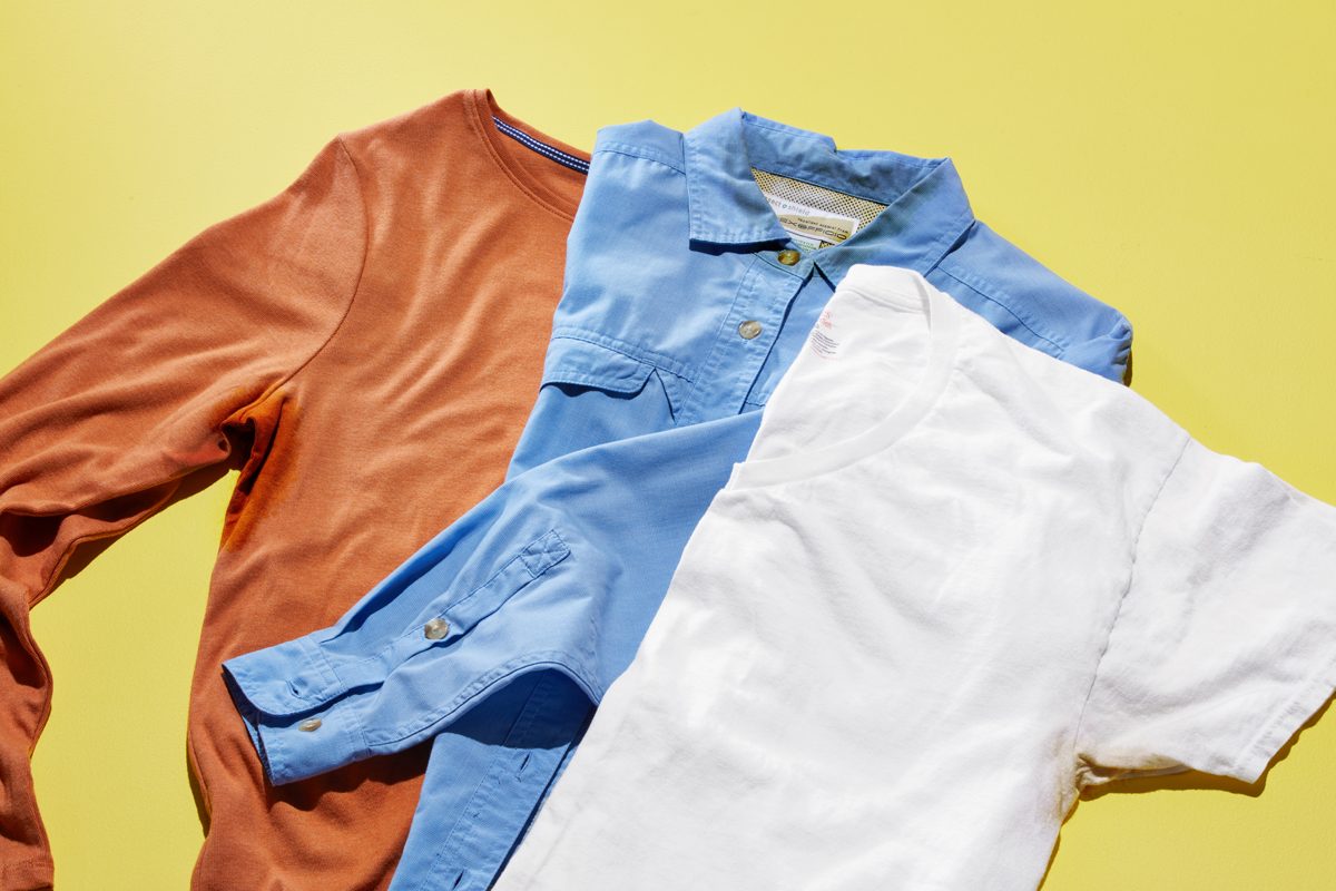 three shirts with sweat stains on a yellow background