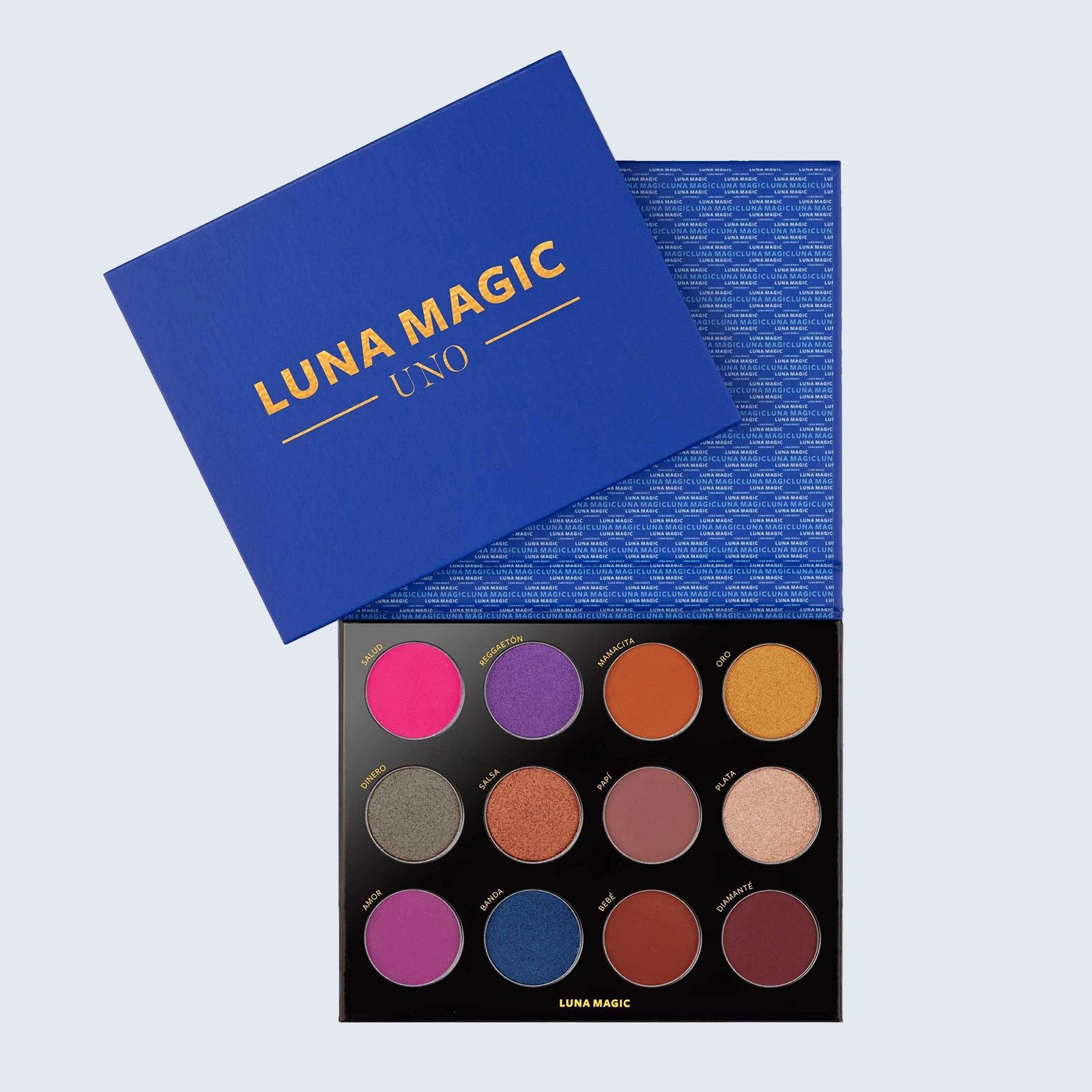 Makeup palette displaying 12 colorful eyeshadows in open box; "LUNA MAGIC UNO" text in a blue lid cover.