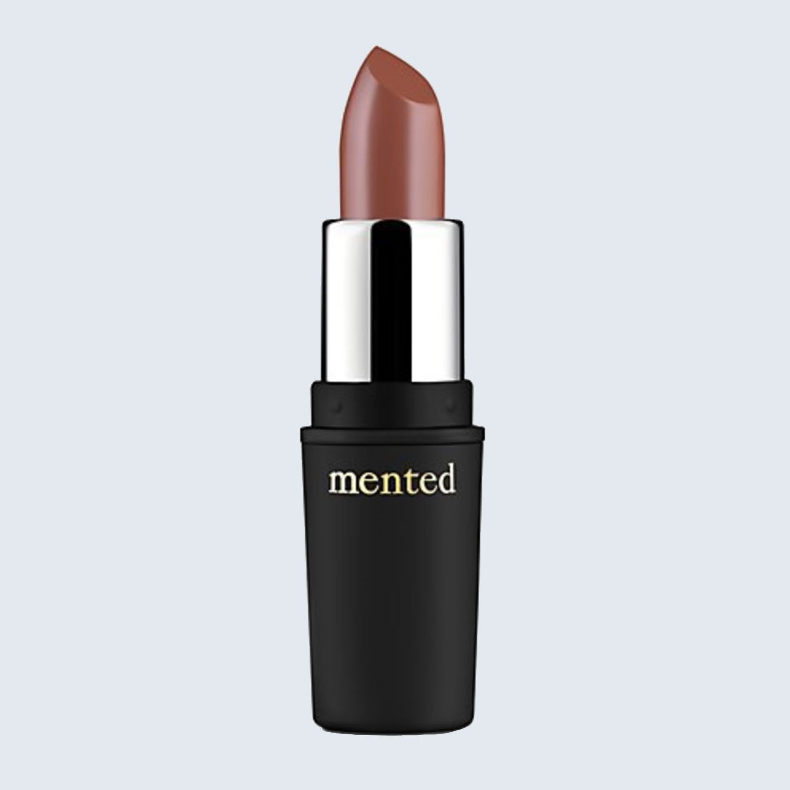 Lipstick stands upright, open showing a brown shade, in a sleek black tube labeled "mented," against a plain light gray background.