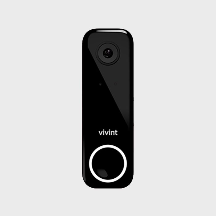Doorbell camera displaying â€œvivintâ€ with lens and button, set against a plain gray background.