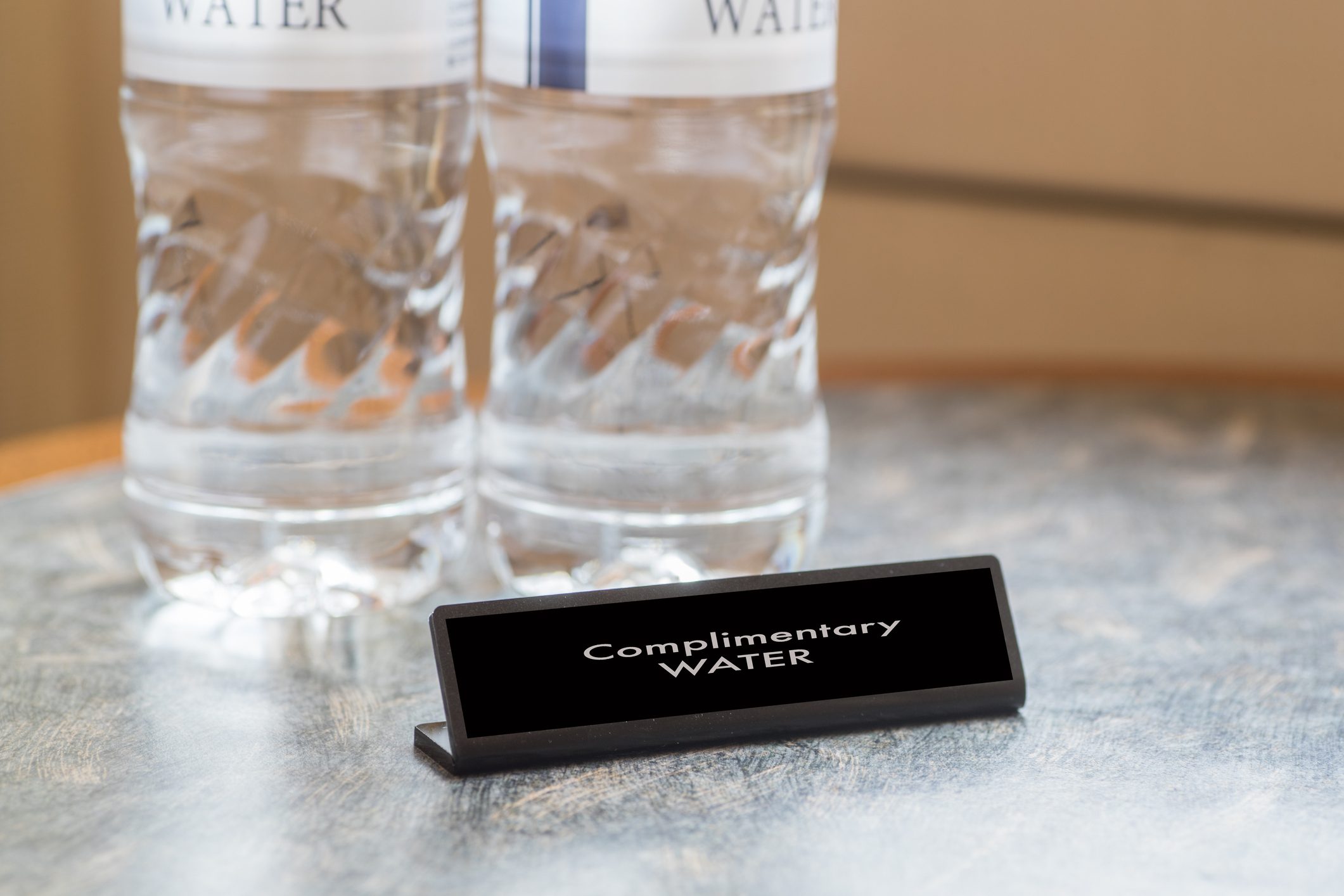 Complimentary water bottle for hotel guest in hotel room