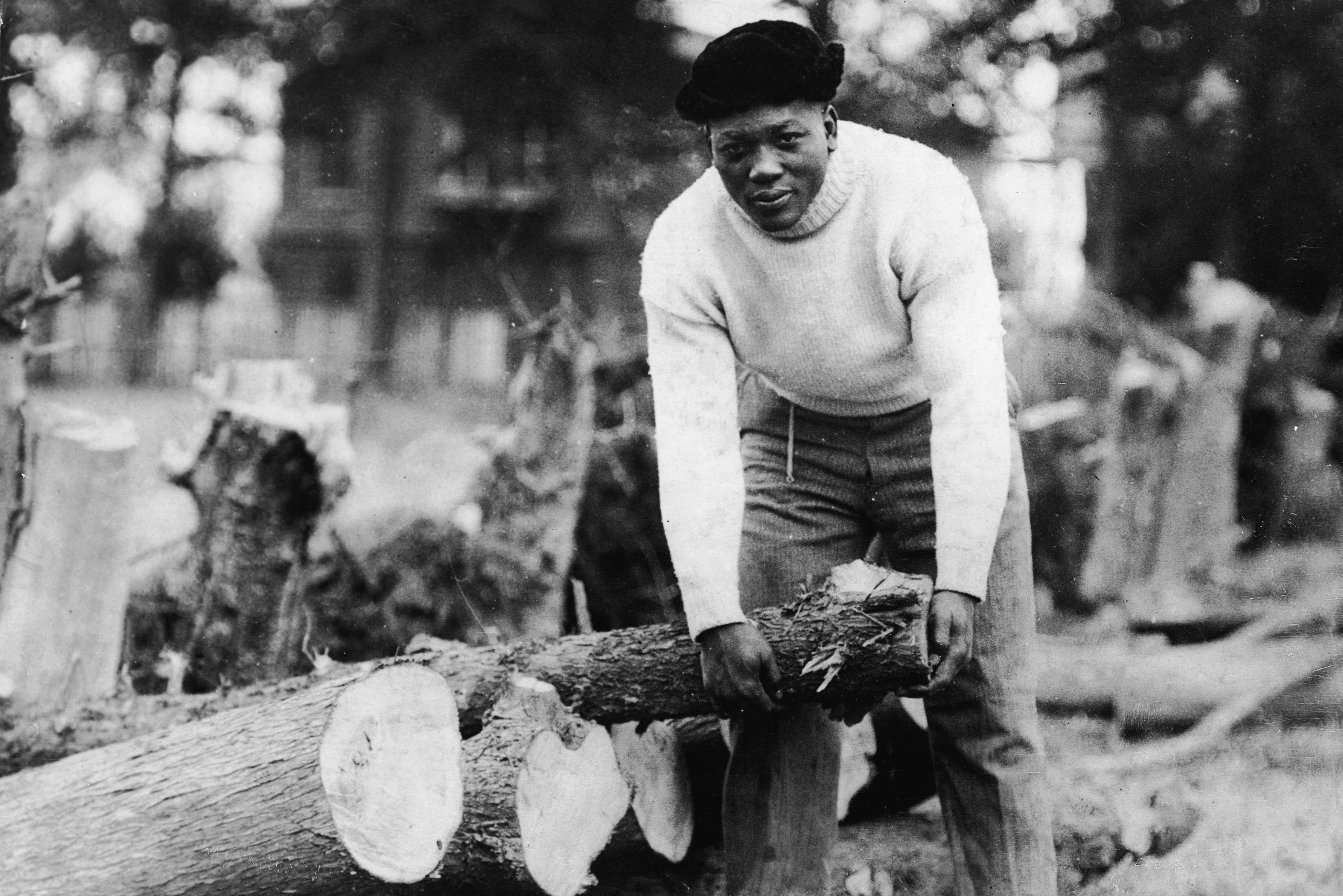 Boxer, Jack Johnson, Picks Up Log