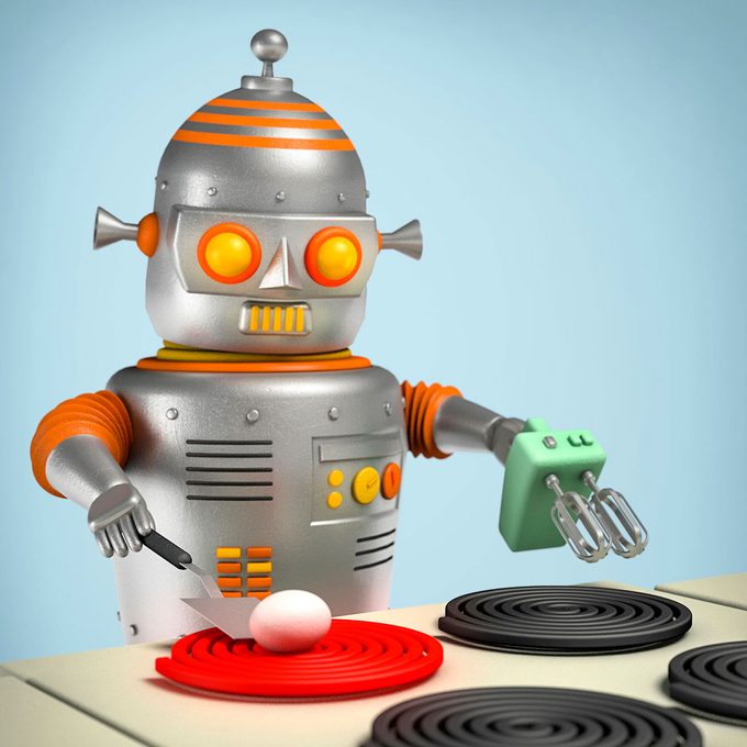 robot incorrectly cooking an egg directly on a stove burner with it still in the shell