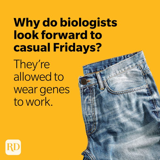 Folded jeans on yellow background