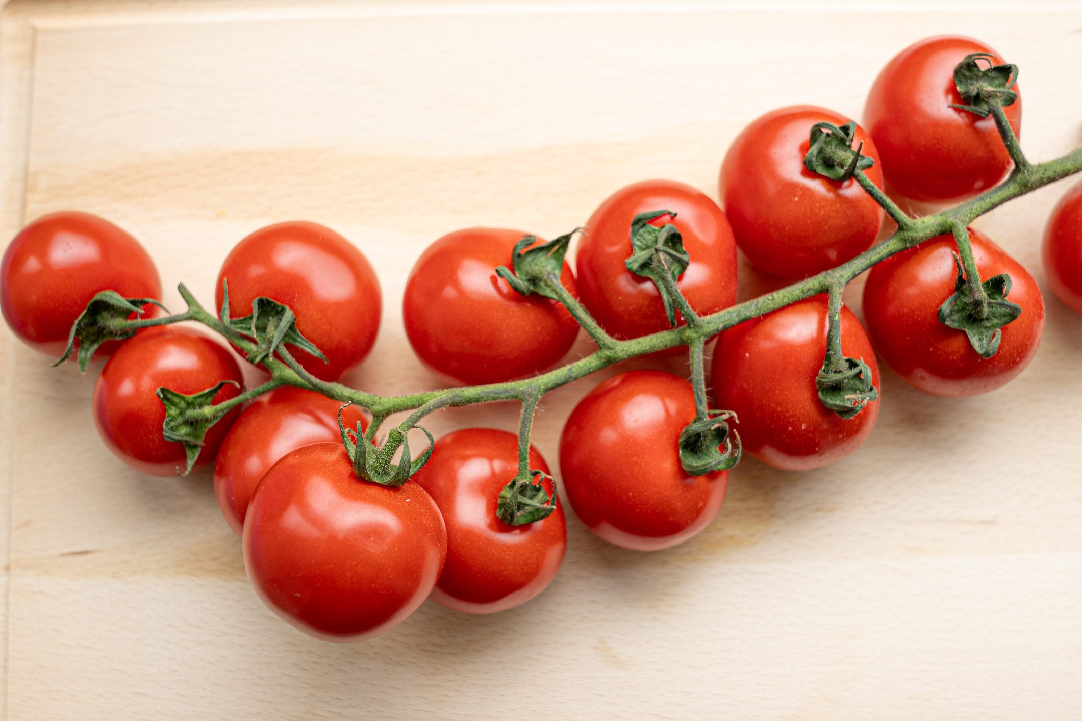 Cherry tomato on a cutting board