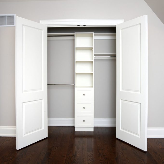 modern bedroom with a closet featuring french doors