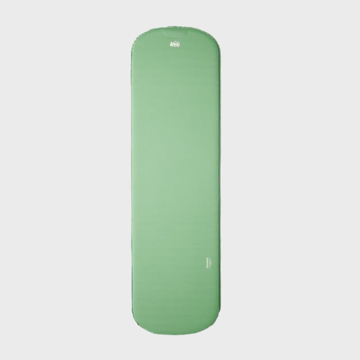 Green sleeping pad, laying flat, against a plain white background with "REI" logo near the top edge.