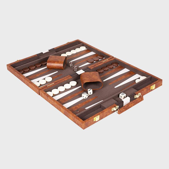 Backgammon set featuring arranged white and brown checkers, and dice on a brown board within an open leather case on a plain background.