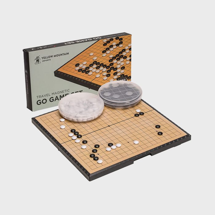 Go board set with black and white stones arranged, surrounded by a box labeled 
