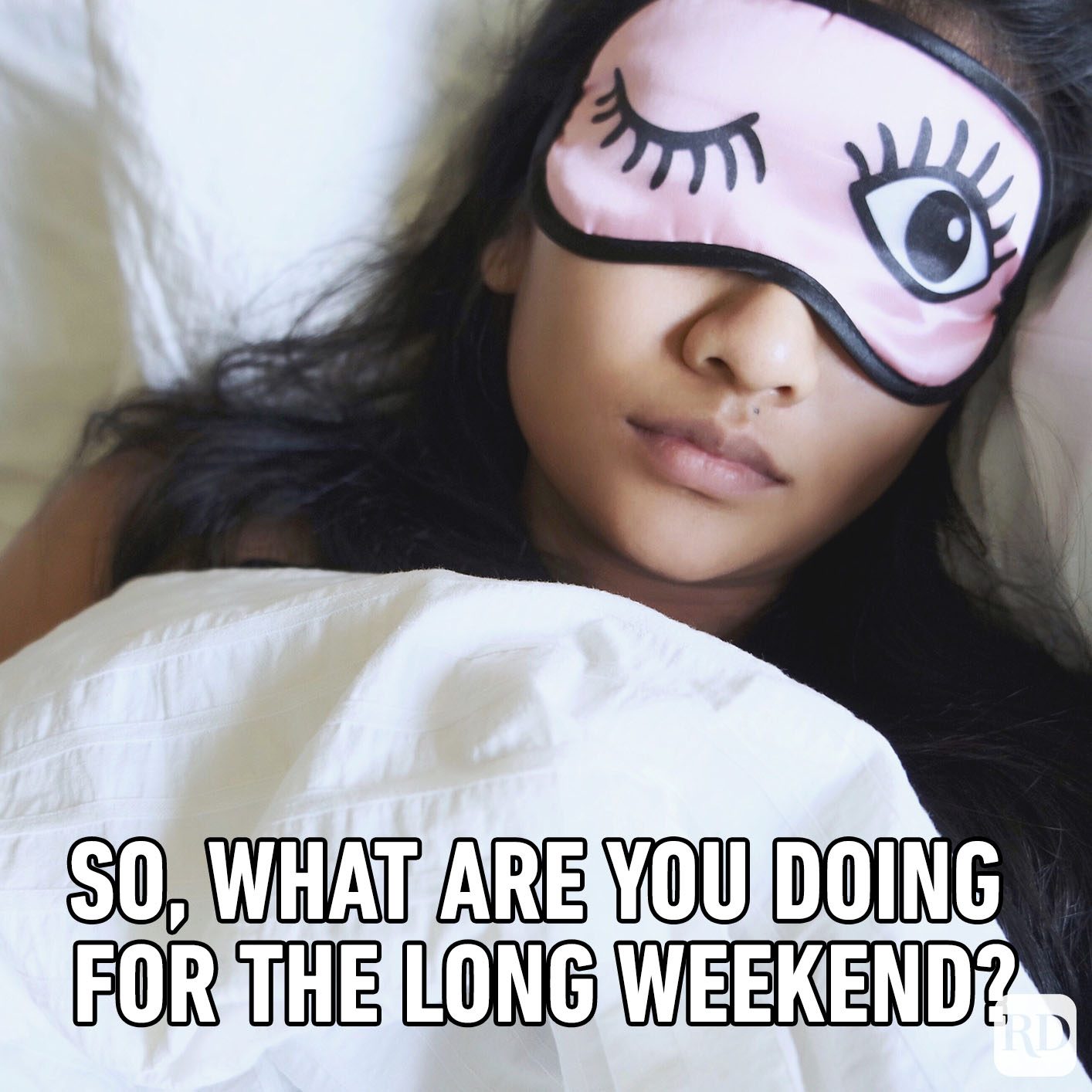 Person wearing a pink sleep mask rests under white sheets. Text reads, "So, what are you doing for the long weekend?"