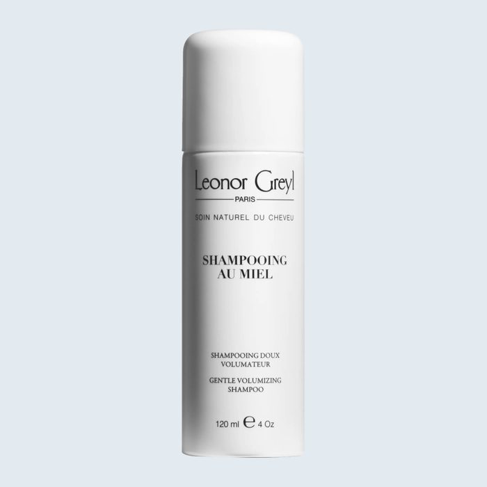 White shampoo bottle, upright, displaying text 