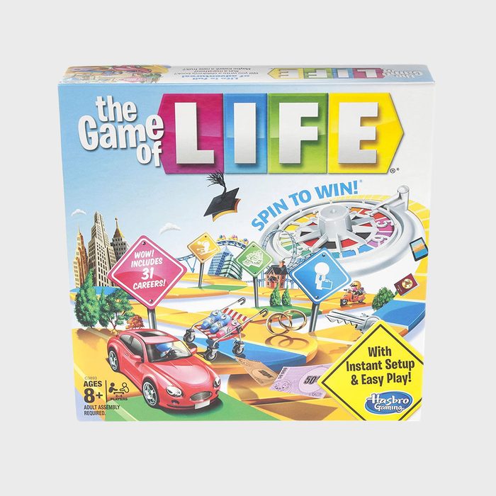Board game box displays colorful graphics; features cars, a spinning wheel, and cityscape; promotes 