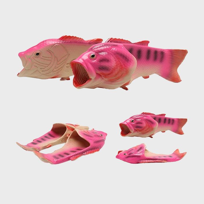 Pink fish-shaped slippers lie scattered, showcasing various angles on a white background.