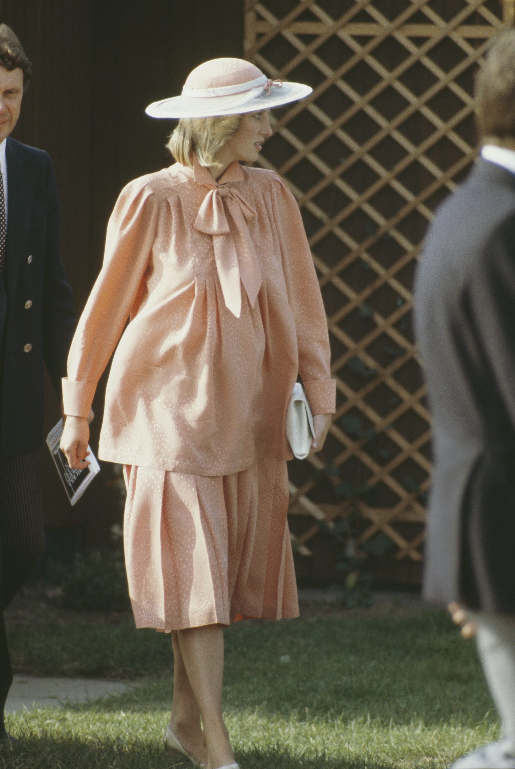 Diana, Princess of Wales at the Guards Polo Club in Windsor, June 1984. She is pregnant with Prince Harry, and wearing a Jan Van Velden maternity suit and hat by Frederick Fox.
