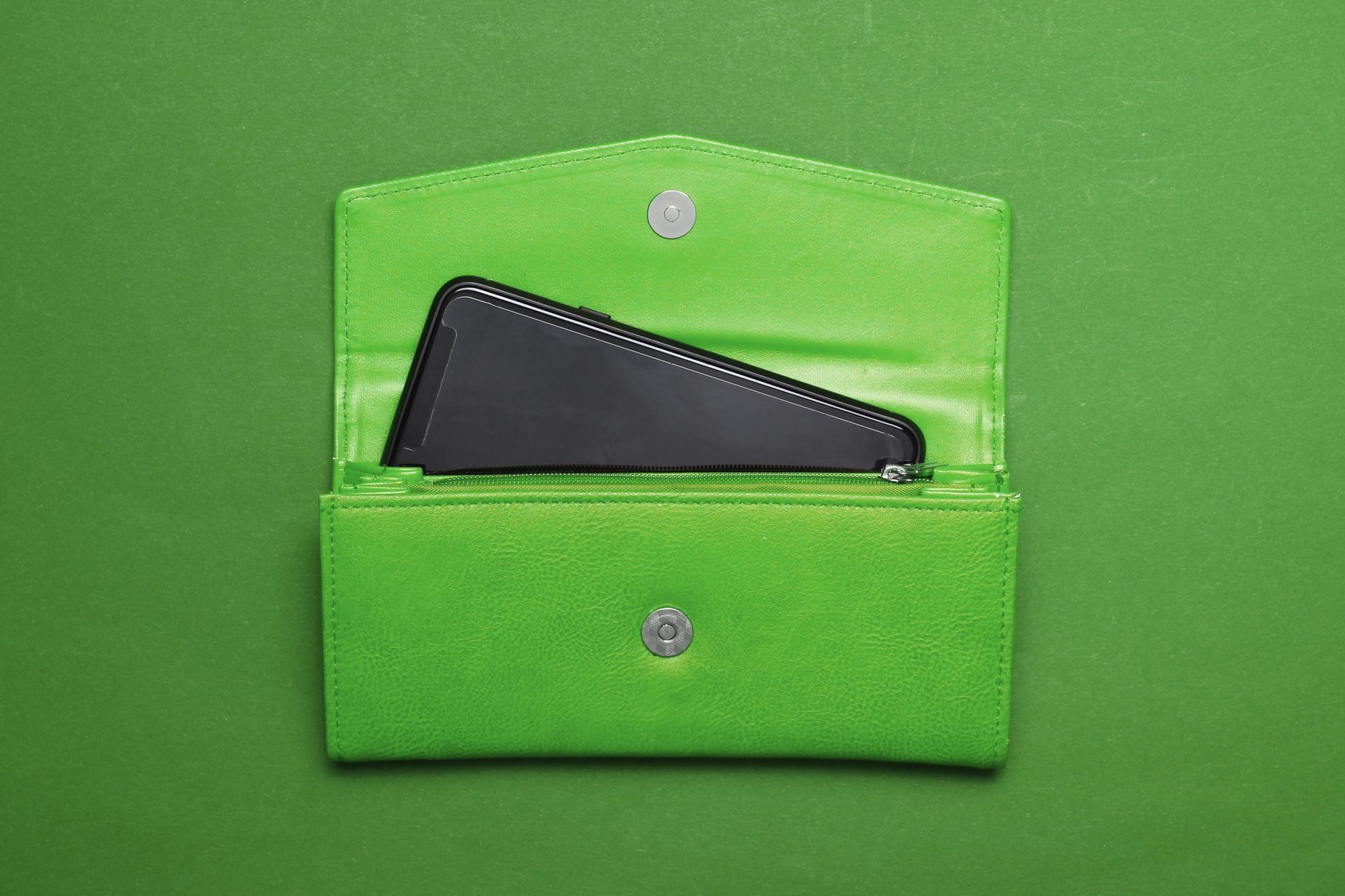 smartphone popping out of open wallet