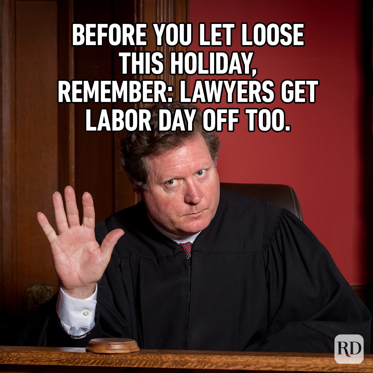 Judge raising hand; courtroom setting. Text reads: "Before you let loose this holiday, remember: Lawyers get Labor Day off too."