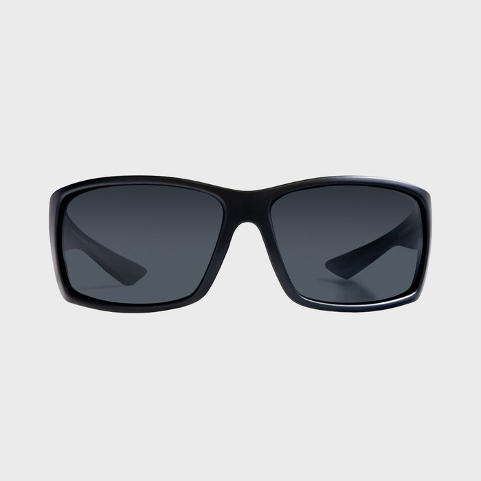 Sunglasses with rectangular black frames and dark lenses appear against a plain light grey background.
