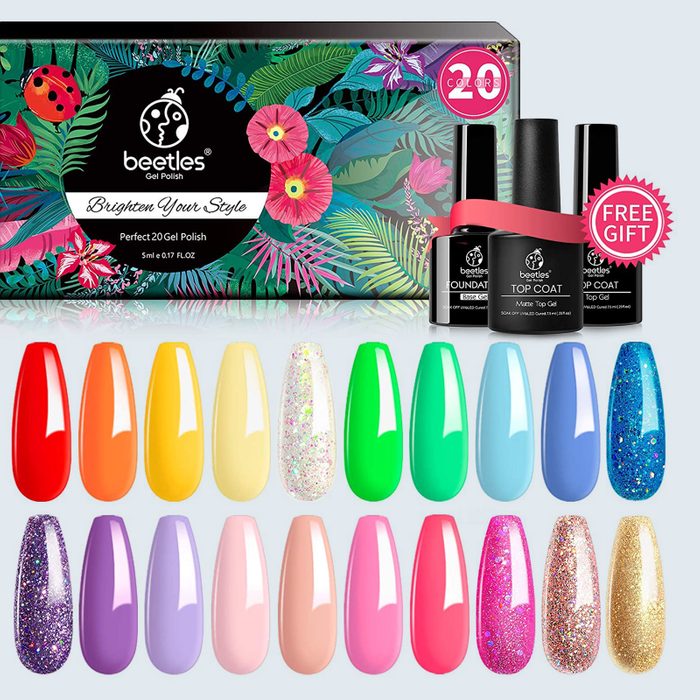 Nail polish set displays vibrant colors, packaged in floral-themed box, with three top coat bottles labeled as a free gift.