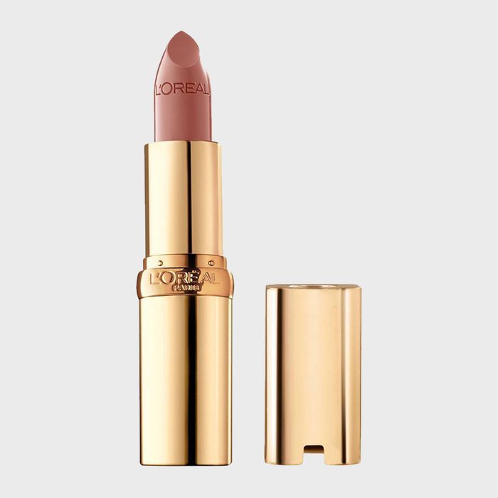 Lipstick, uncapped and upright, gold tube with 