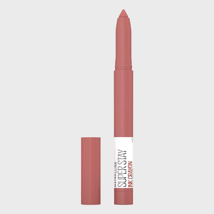 Lip crayon stands upright, uncapped, showcasing its pointed tip against a plain background; labeled 