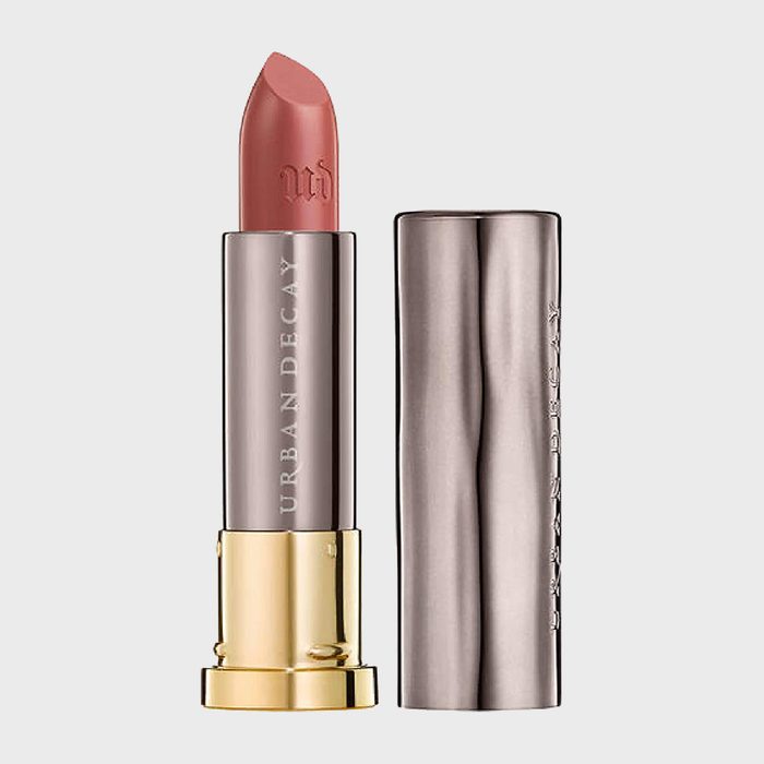Lipstick stands upright; cap beside it. Text 