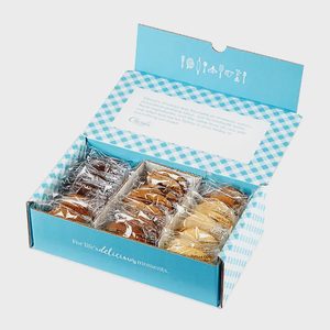 Box of individually wrapped cookies, open with lid text and design, displayed in a blue-checkered packaging.