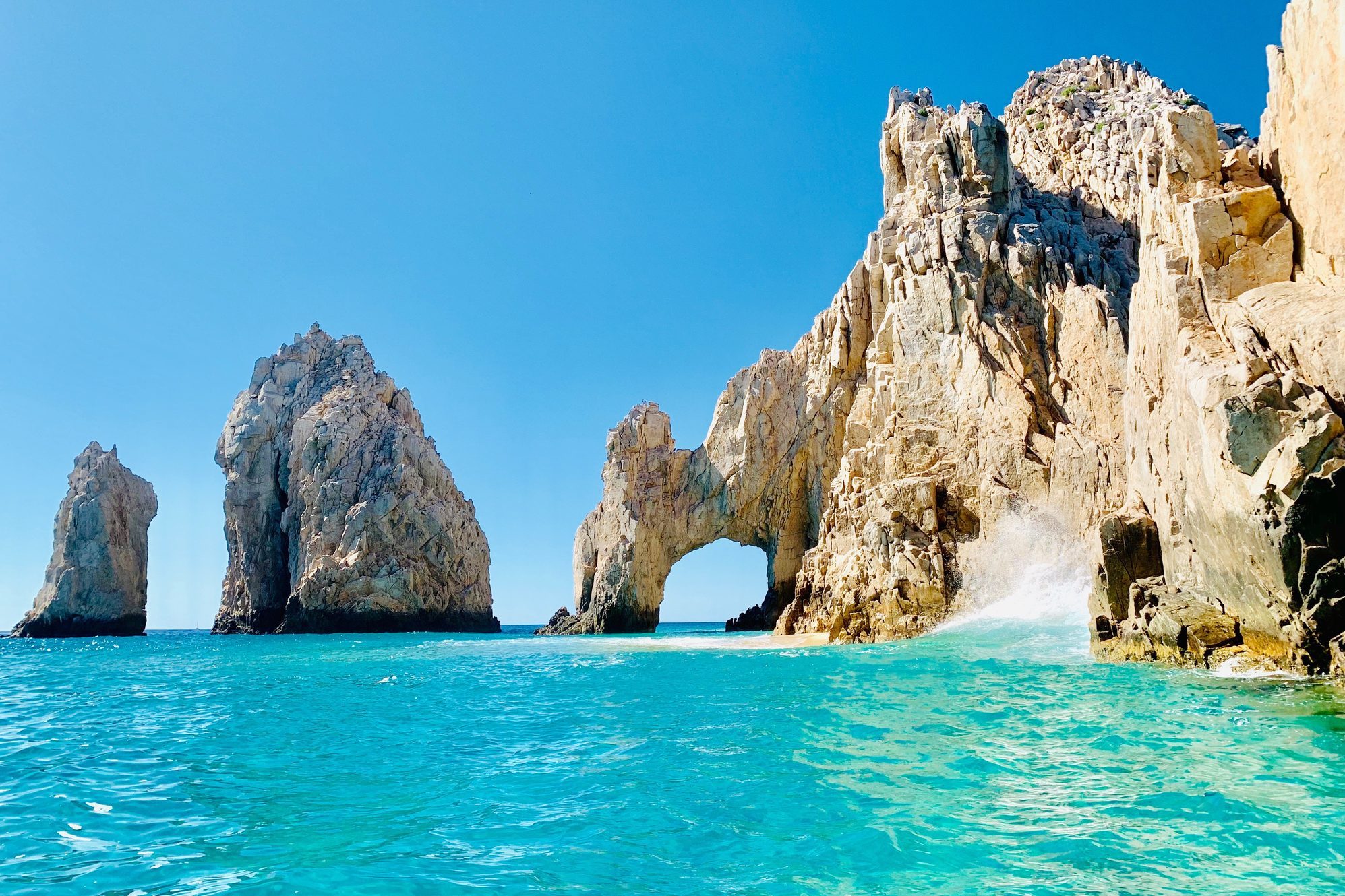 Panoramic View Of Sea And Rocks Against Blue Sky