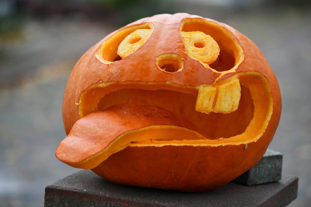 goofy face carved into a halloween pumpkin