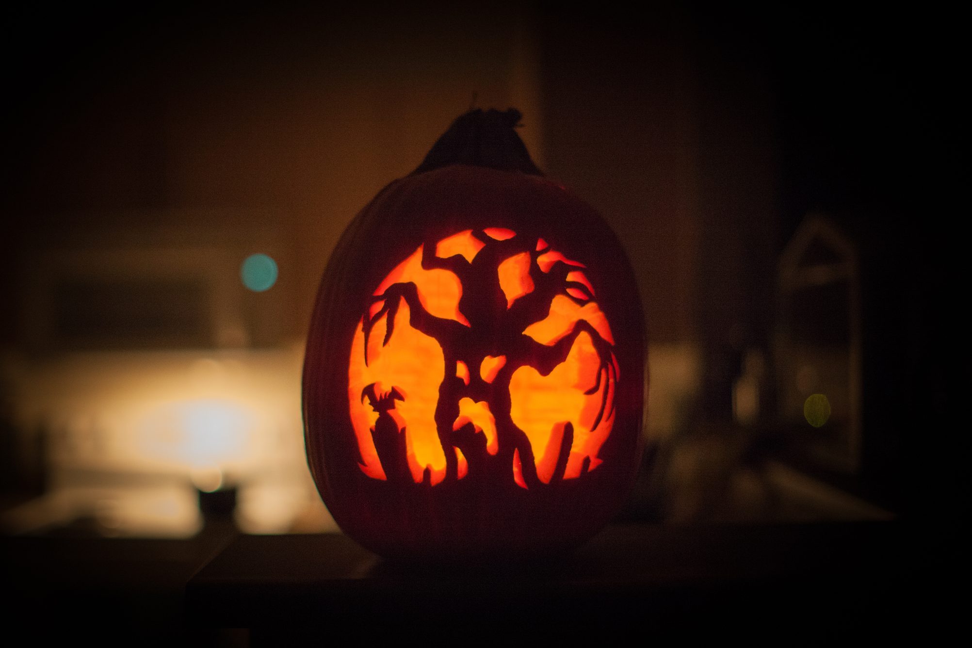 scary tree carved into a pumpkin