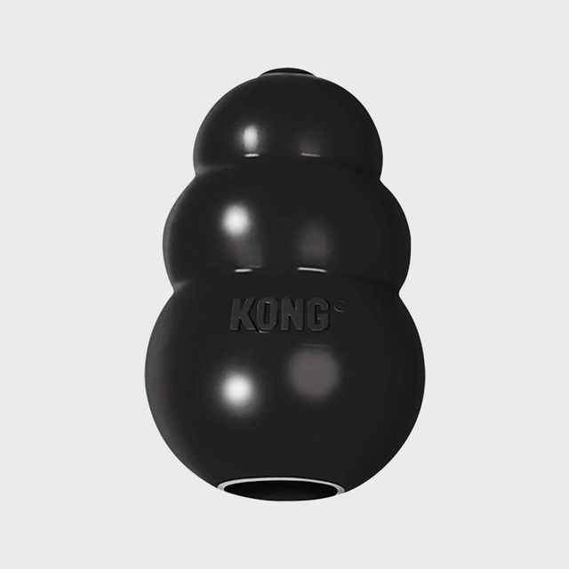 Black rubber toy remains still, featuring 