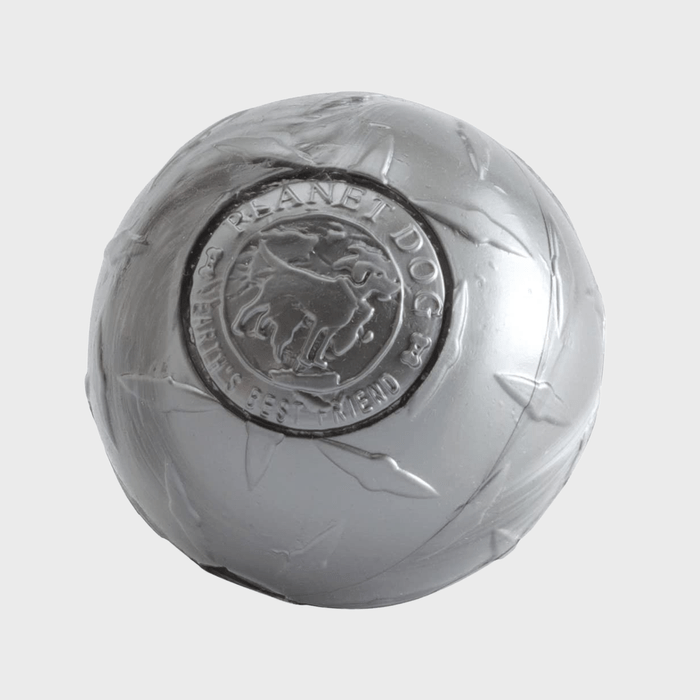 A gray ball with embossed dog design, labeled 