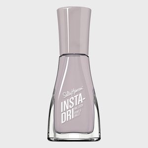 Nail polish bottle stands upright, displaying 