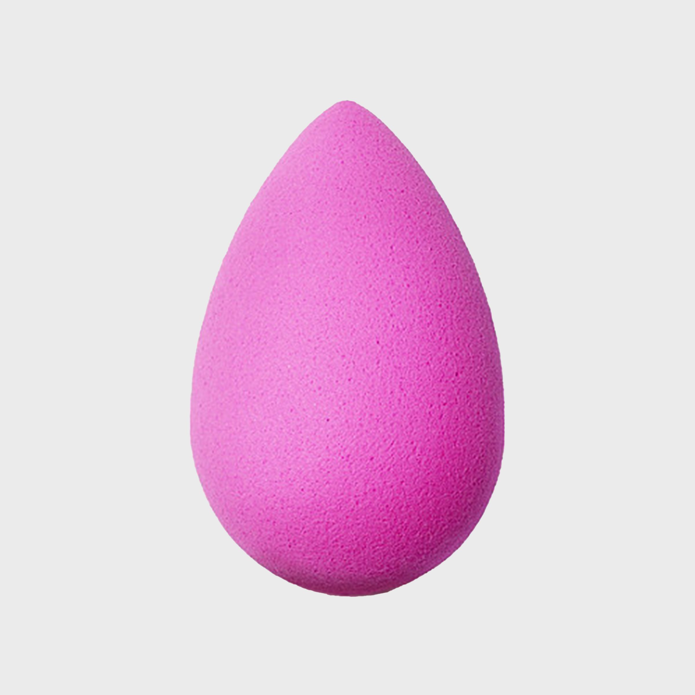 Pink teardrop-shaped sponge resting against a simple white background.