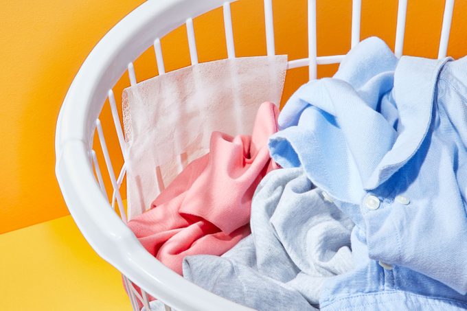 dryer sheet in a laundry basket with laundry