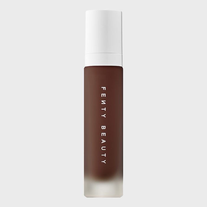 A frosted bottle stands vertically, displaying 