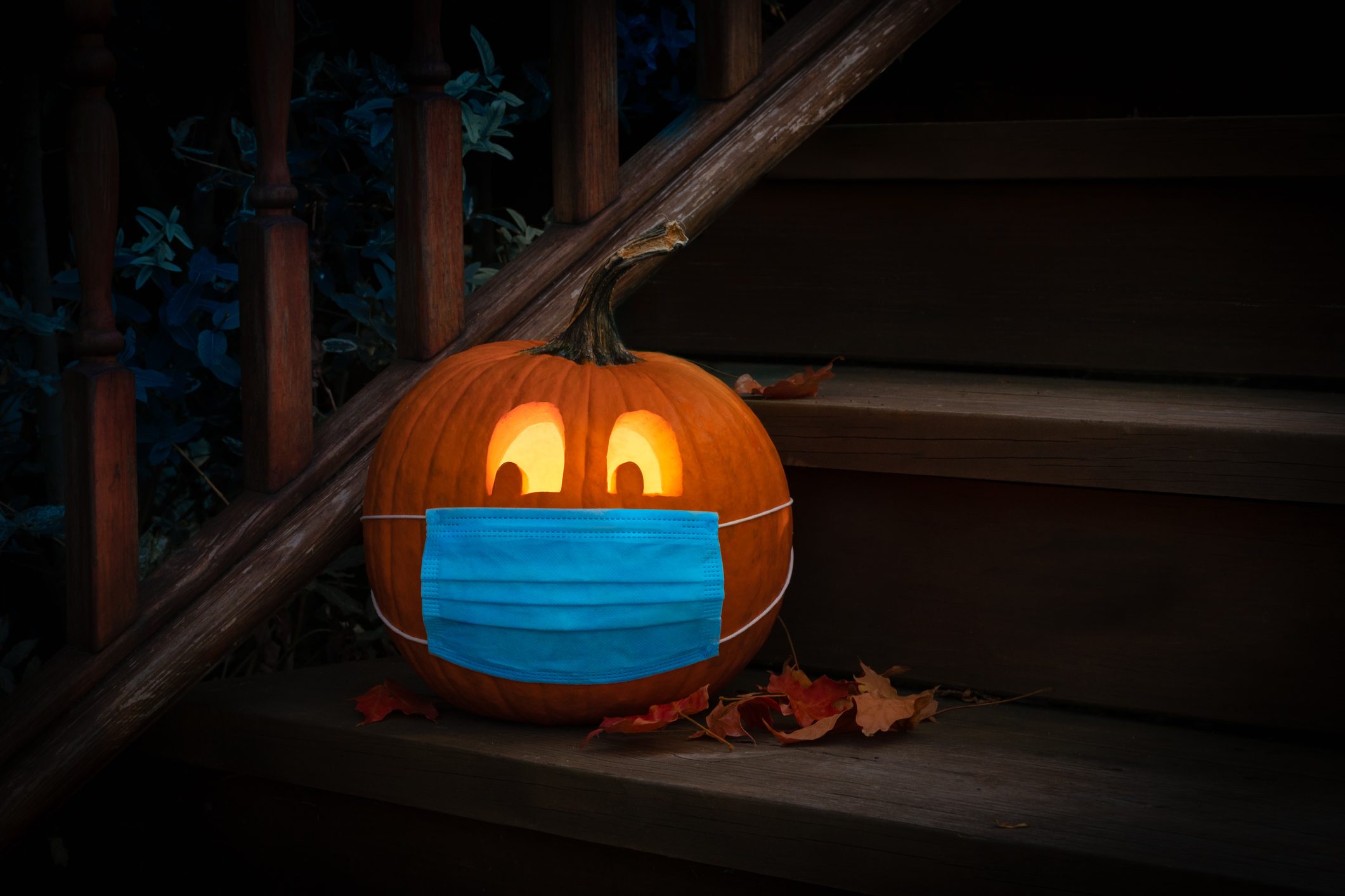 Lighted Halloween Pumpkin Jack o Lantern Wearing Covid PPE Mask On Steps