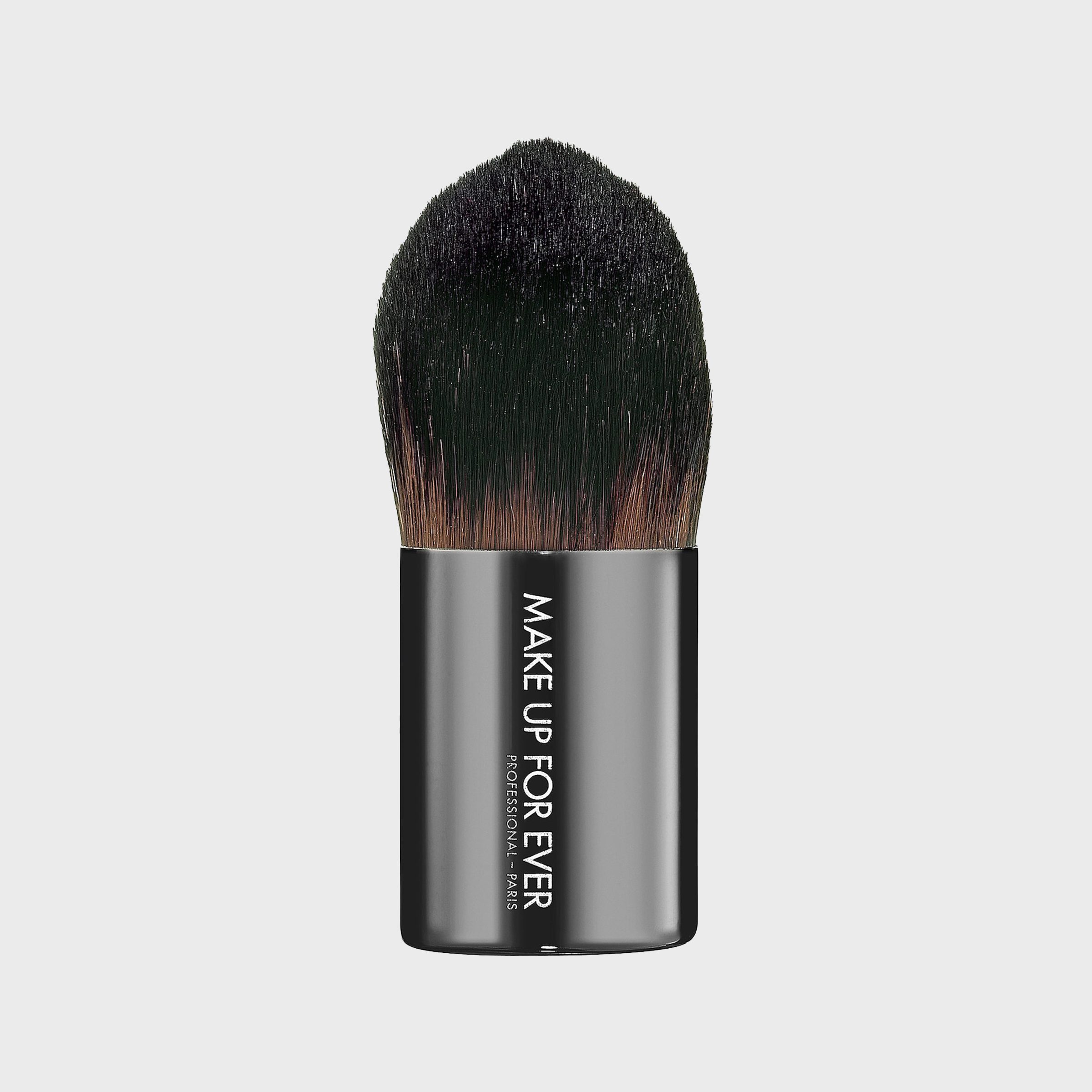 Brush displaying text "MAKE UP FOR EVER" vertically, with dark bristles, set against a plain gray background.