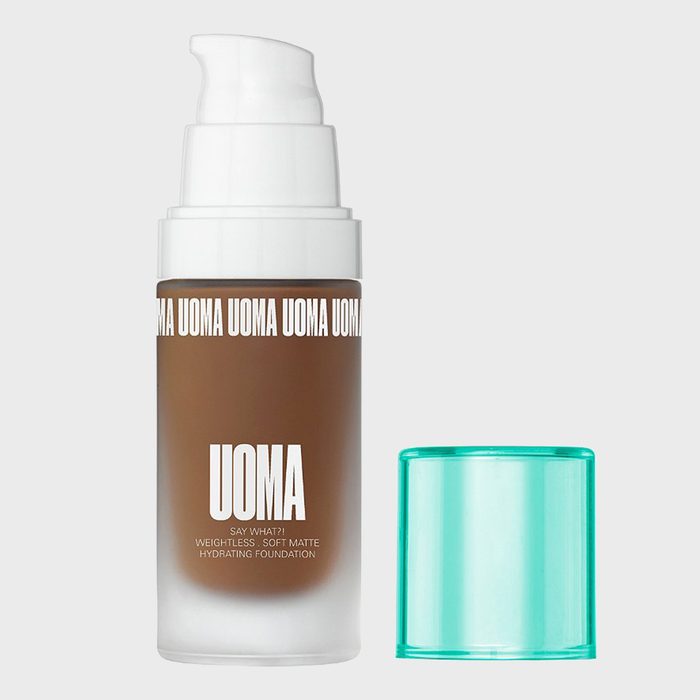 A foundation bottle with pump in a white and brown design. Text reads 
