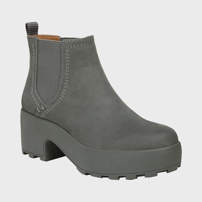 Gray ankle boot with elastic side panel sits on white background. It features a chunky sole and pull tab at the back.
