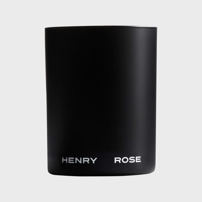 A black cylindrical container stands upright, labeled 