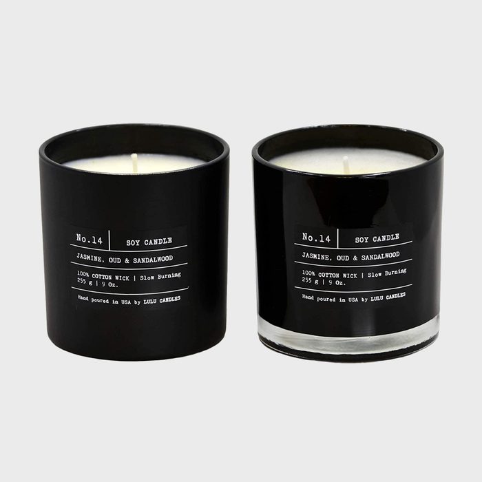Two black candles rest side by side, labeled 