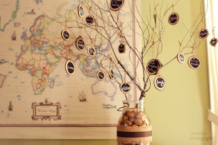 Branches in a jar hang chalkboard discs with words like 