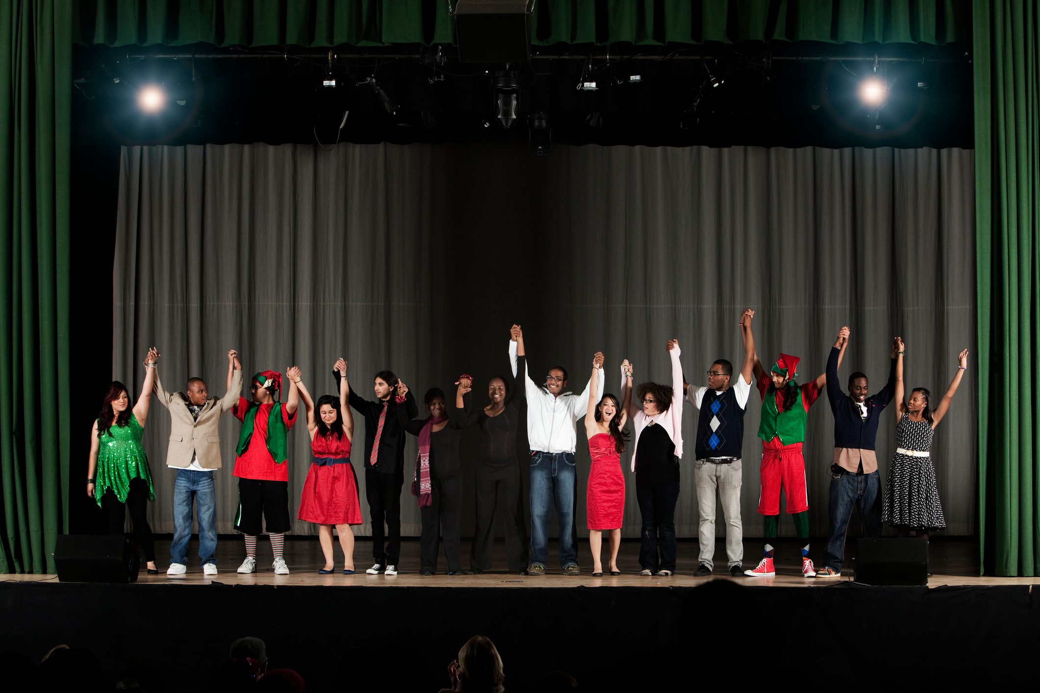 Students bowing on high school stage
