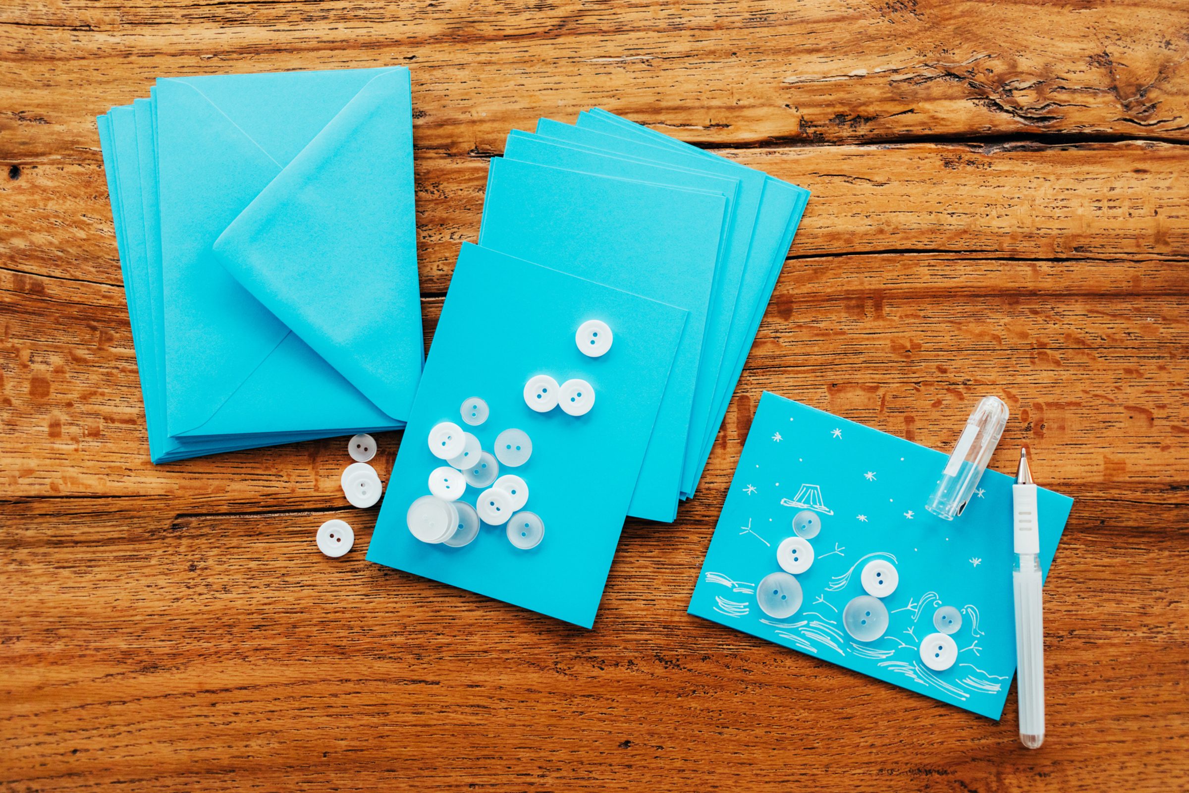 Handmade Christmas greeting cards on wooden table